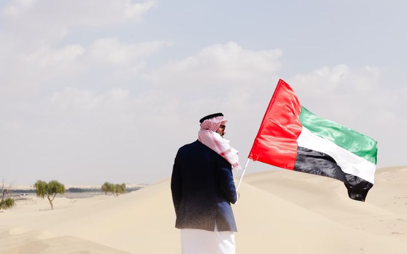 Man Holding UAE National Flag