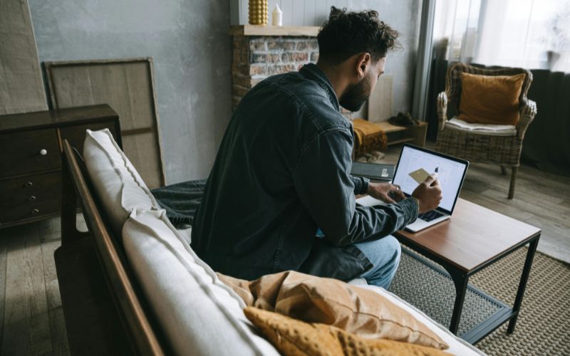 man checking on laptop