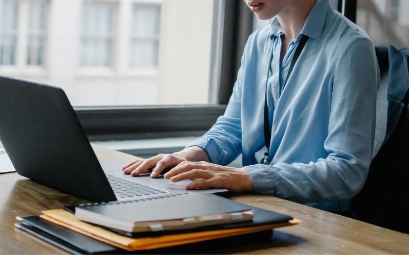 woman checking on laptop