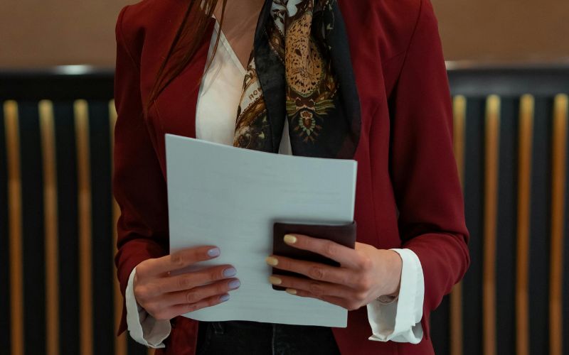 women holding document